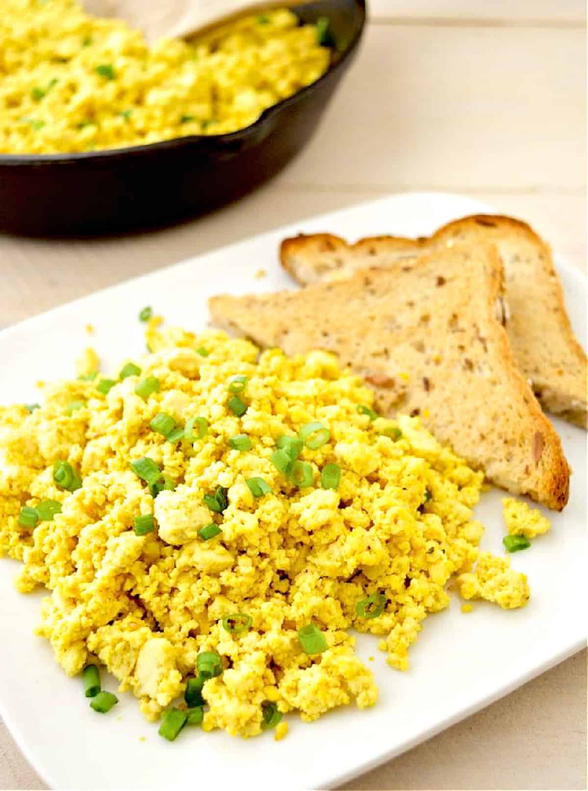 Tofu scramble on a plate with toast.