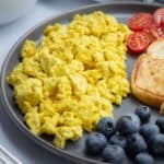 Tofu scramble on a dark plate.