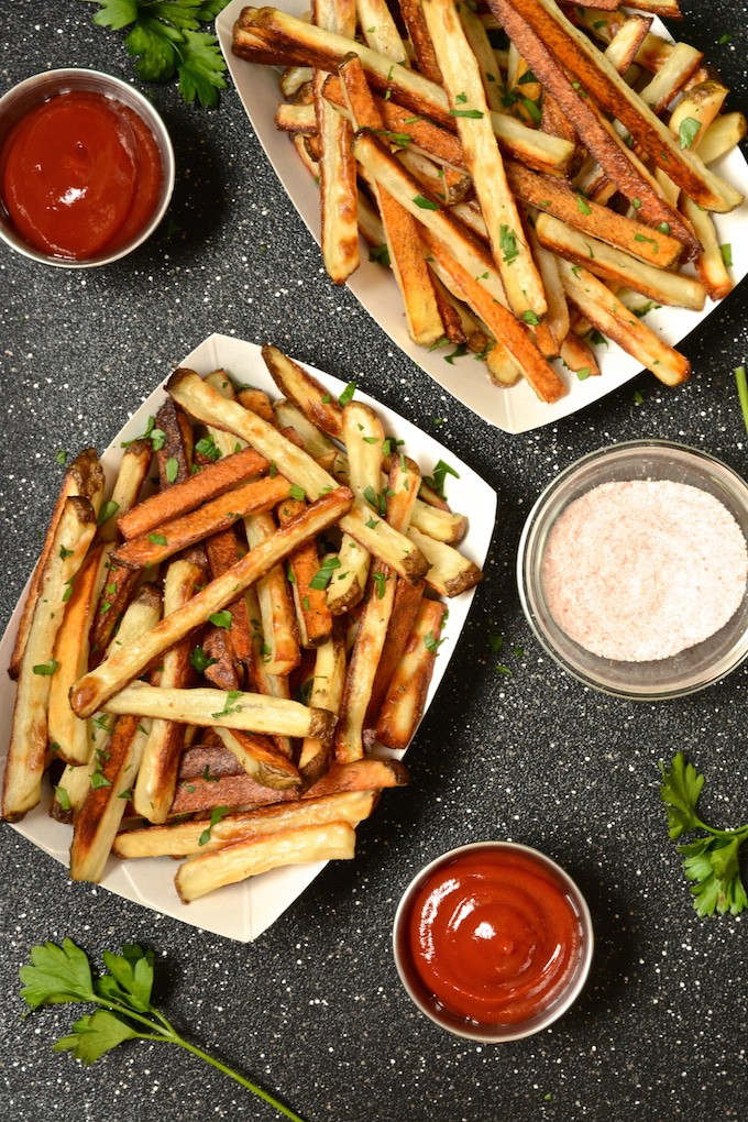 These crispy baked seasoned fries are tender on the inside and lightly crispy on the outside. They make a great side to any vegan burger. Since the fries are baked, not fried, you can indulge in a healthier option!