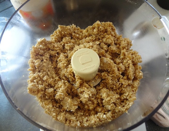 Walnut oat crust, for a vegan strawberry pie, in a food processor after being blended