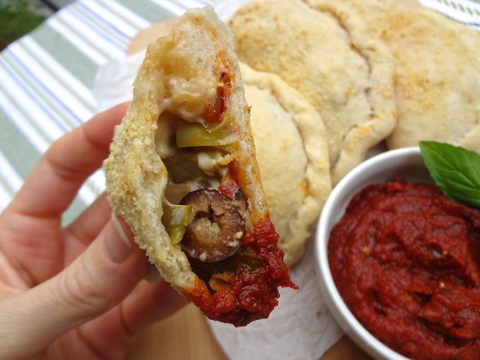 Addicting vegan pizza pockets / calzones! They have been a hit for the family and are great for freezing... The homemade marinara recipe doubles as a dip.