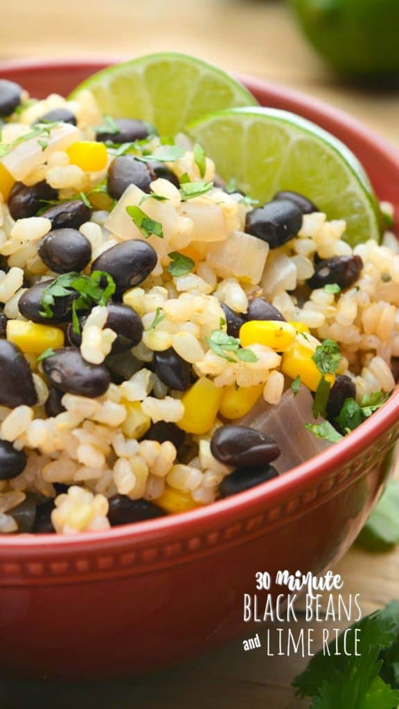 a close up of black beans and lime rice.