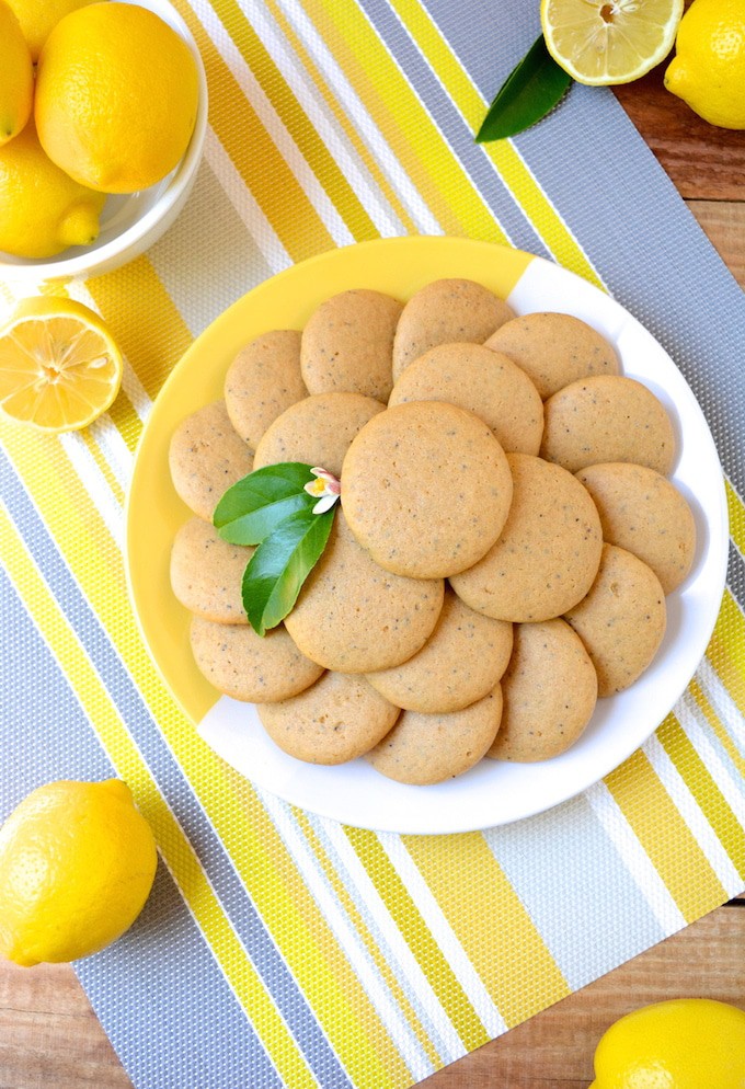 Soft, Vegan Lemon Poppy Seed Cookies, a simple recipe that's bursting with fresh lemon flavor. These melt-in-your-mouth cookies are free of egg, dairy and refined sugar –which makes them a healthier option! Flavored with fresh squeezed lemon juice, these soft and tender cookies are sure to be your new favorite treat! 