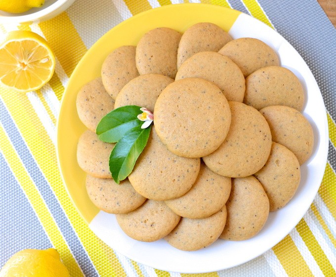 Soft, Vegan Lemon Poppy Seed Cookies, a simple recipe that's bursting with fresh lemon flavor. These melt-in-your-mouth cookies are free of egg, dairy and refined sugar –which makes them a healthier option! Flavored with fresh squeezed lemon juice, these soft and tender cookies are sure to be your new favorite treat! 