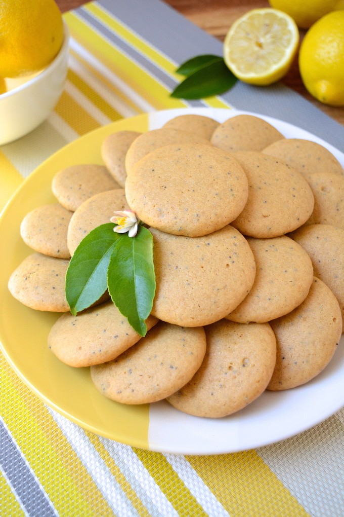 Soft, Vegan Lemon Poppy Seed Cookies, a simple recipe that's bursting with fresh lemon flavor. These melt-in-your-mouth cookies are free of egg, dairy and refined sugar –which makes them a healthier option! Flavored with fresh squeezed lemon juice, these soft and tender cookies are sure to be your new favorite treat! 