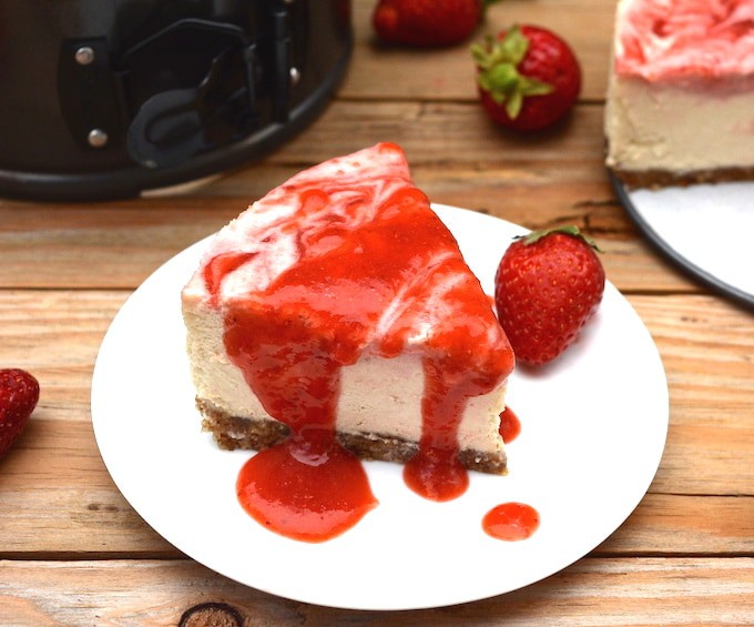 A vegan No-Bake Strawberry Swirl Cheesecake worth hoarding! It has the authentic cheesecake taste without the heavy dairy. This healthier, rich & creamy cheesecake is easy to whip-up, only takes 10 ingredients and includes a fresh strawberry swirl top with extra for drizzling! (vegan, dairy-free, gluten-free)