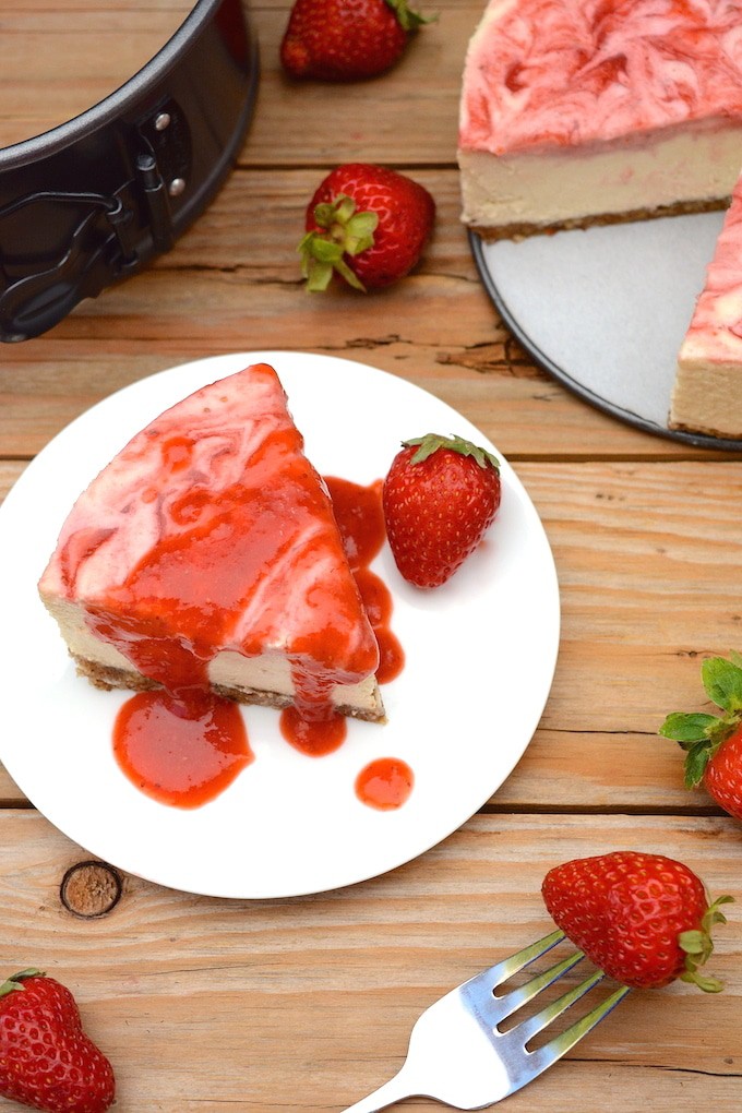 A vegan No-Bake Strawberry Swirl Cheesecake worth hoarding! It has the authentic cheesecake taste without the heavy dairy. This healthier, rich & creamy cheesecake is easy to whip-up, only takes 10 ingredients and includes a fresh strawberry swirl top with extra for drizzling! (vegan, dairy-free, gluten-free)