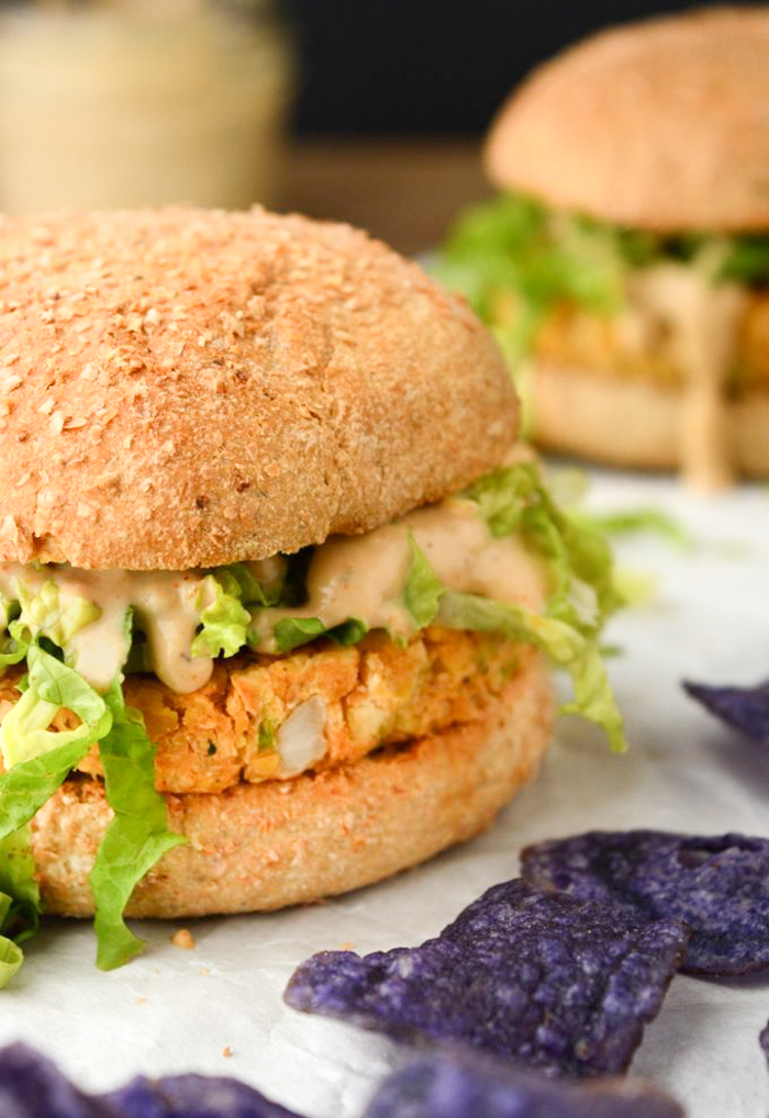 Chickpea Burgers with Spicy Cajun Sauce are vegan food obsession worthy! The chickpea patties are kid friendly. The sauce, however, may not be! But that won’t stop you from slathering this spicy cajun sauce on every bite! Serve with a side of chips, or baked fries, for the perfect weeknight dinner! (gluten-free option)