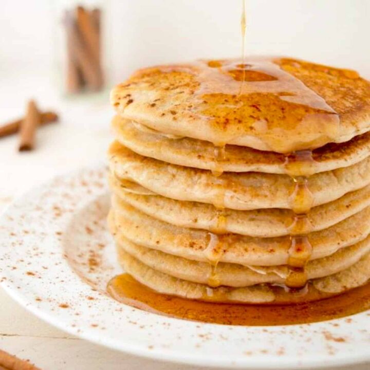 a stack of pancakes with maple syrup.