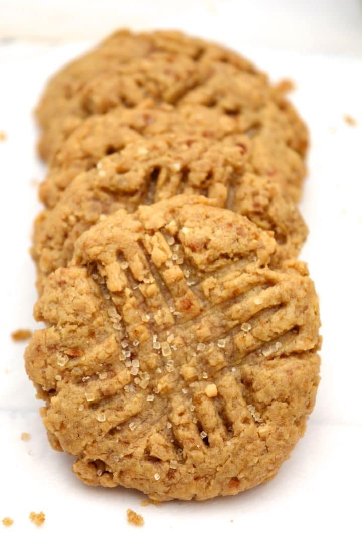 Vegan peanut butter cookies leaning against each other.