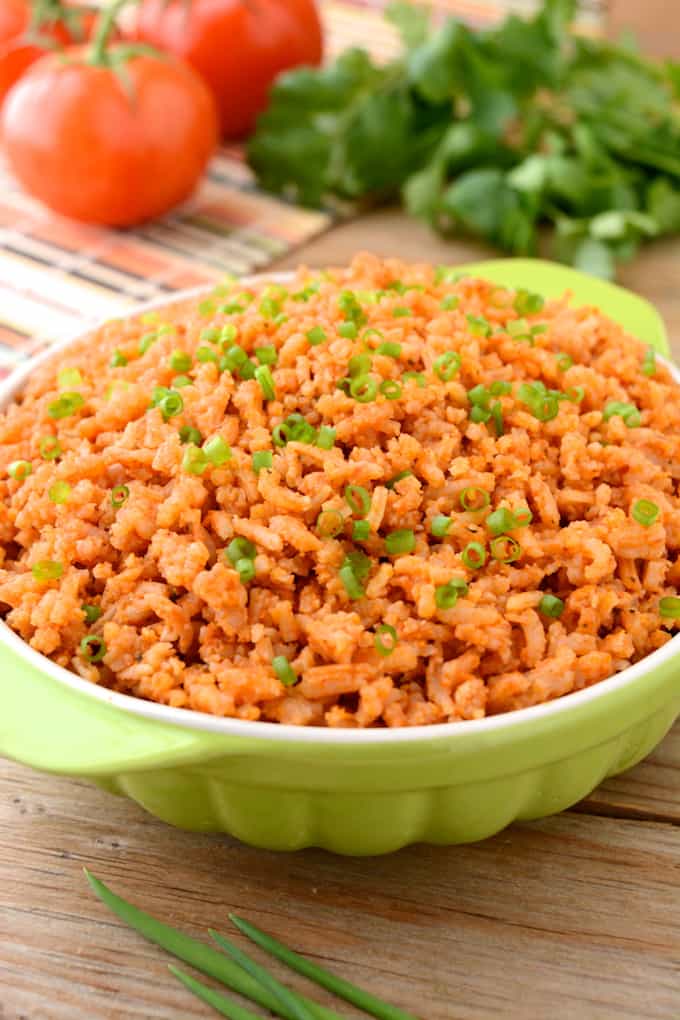 spanish rice in a green serving bowl
