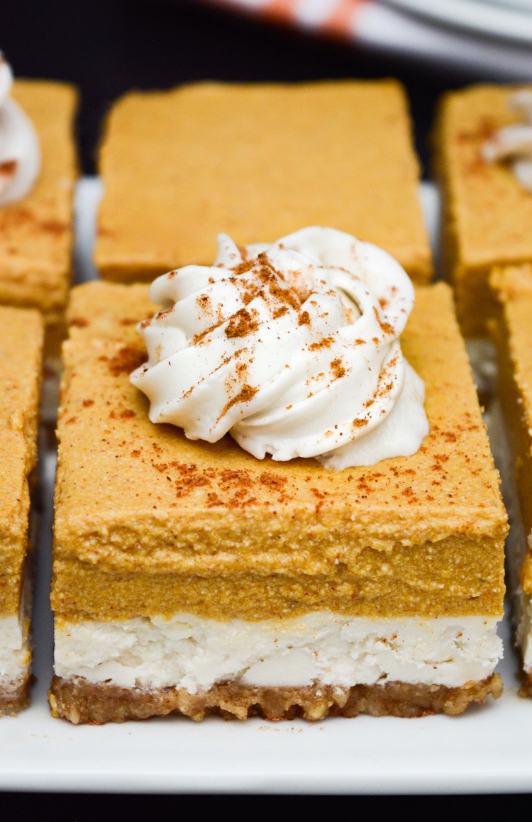 Vegan Pumpkin Cheesecake Bars are an easy, no-bake Fall recipe! The walnut crust pairs perfectly with the classic cheesecake and spiced pumpkin layers. Top the bars with coconut whip for a decedent Fall dessert. gluten-free, no refined sugar and no added oil!