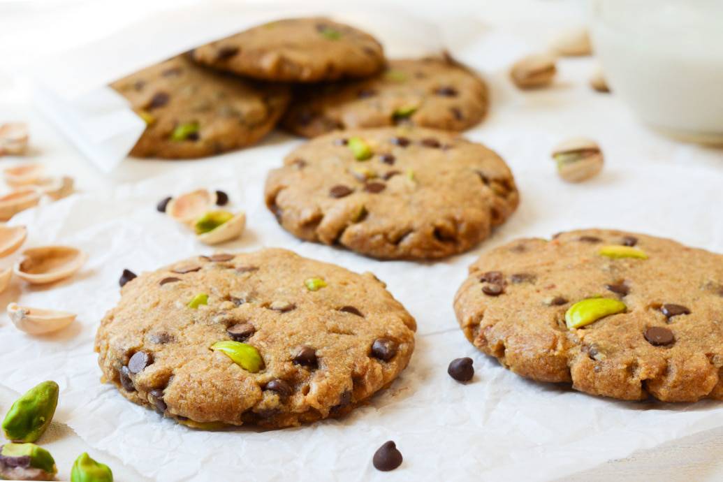 Vegan Pistachio Chocolate Chip Cookies are loaded with salty pistachios and mini chocolate chips. The sweet/salty combo makes them an ideal baked treat! They’re egg-free, dairy-free and even refined-sugar-free!