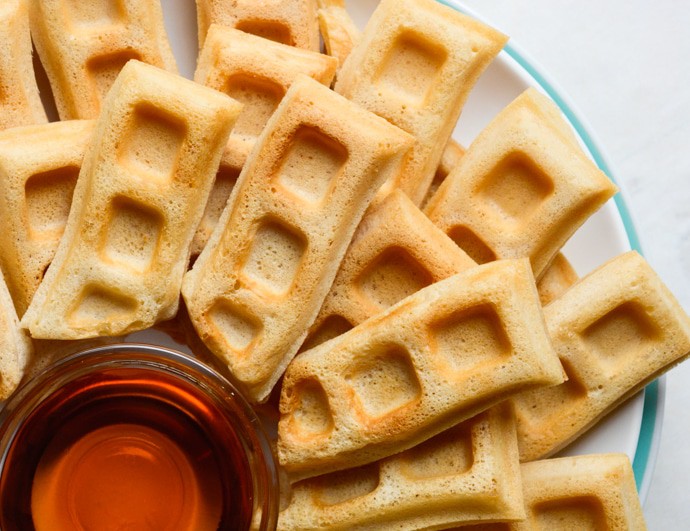 Vegan Vanilla Waffle sticks are a fun, dippable breakfast for kids and adults alike! A few special ingredients give these homemade waffle sticks an extra crispy outside while the center remains soft and fluffy. Keep the recipe classic and serve with maple syrup or go all out with a fancy fruit dip and coconut whipped cream! 