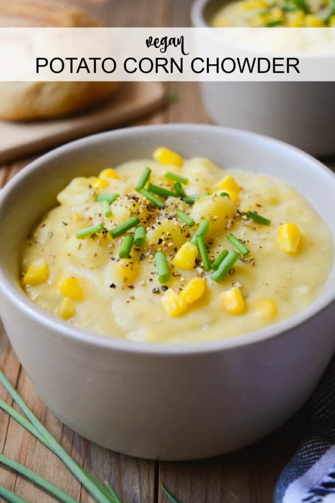 A bowl of vegan potato corn chowder topped with chives.