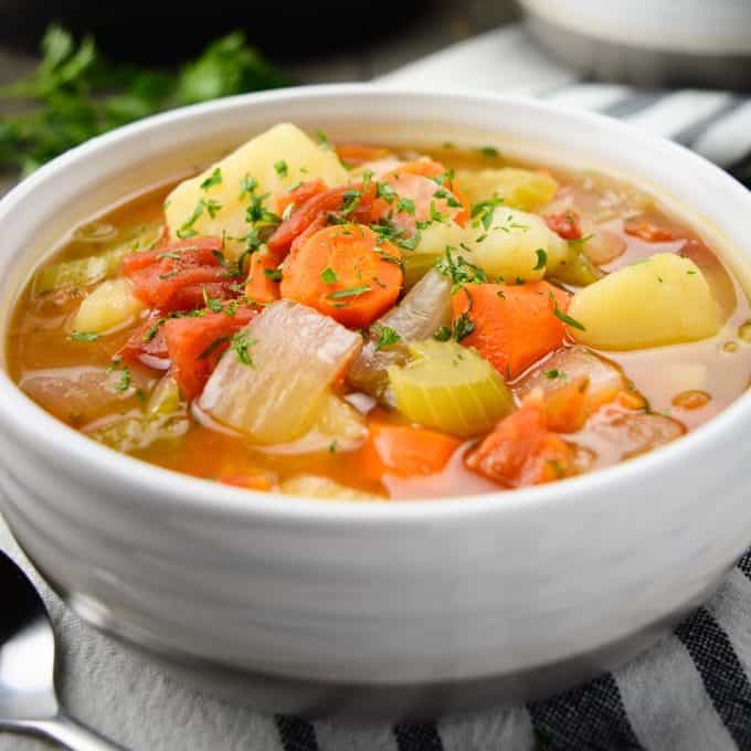 Instant Pot Vegetable Soup loaded with carrots, potatoes, onion, tomatoes and celery.