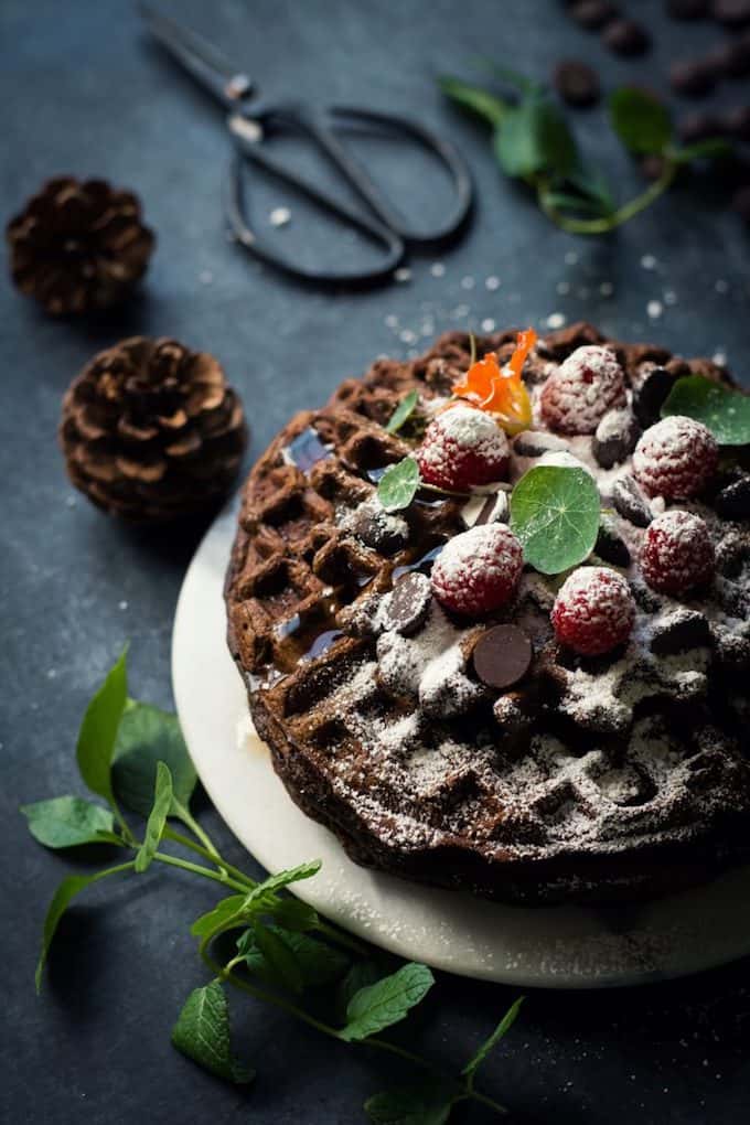 Chocolate sweet potato waffles on a white plate