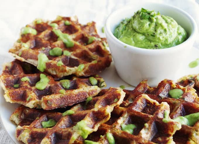 Savory potato leek waffles with side of zesty avocado sauce.