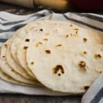 A stack of cooked tortillas.