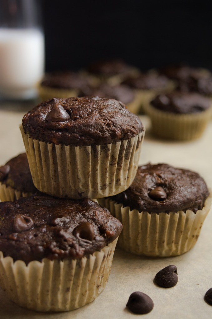 vegan chocolate banana muffins stacked.