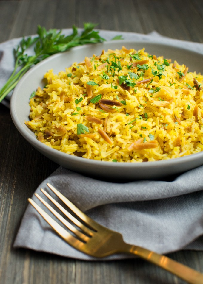 Instant-Pot rice pilaf on a gray plate with a fork.