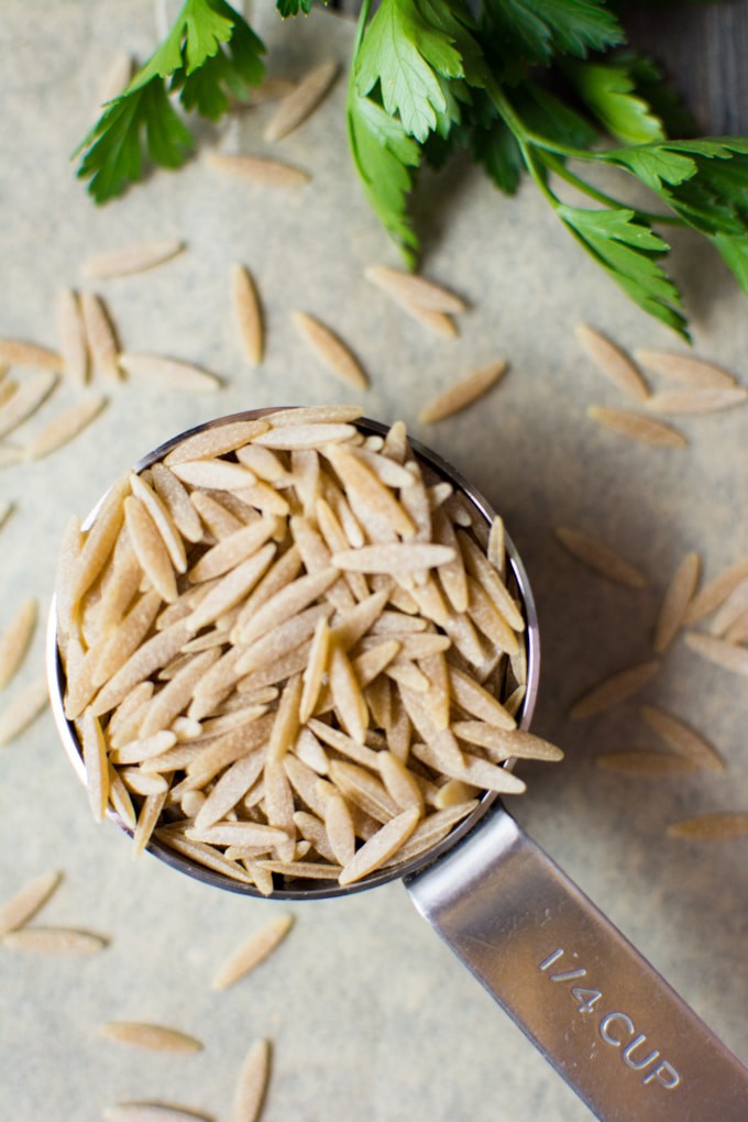 Orzo pasta in a measuring cup for Instant-Pot rice pilaf.