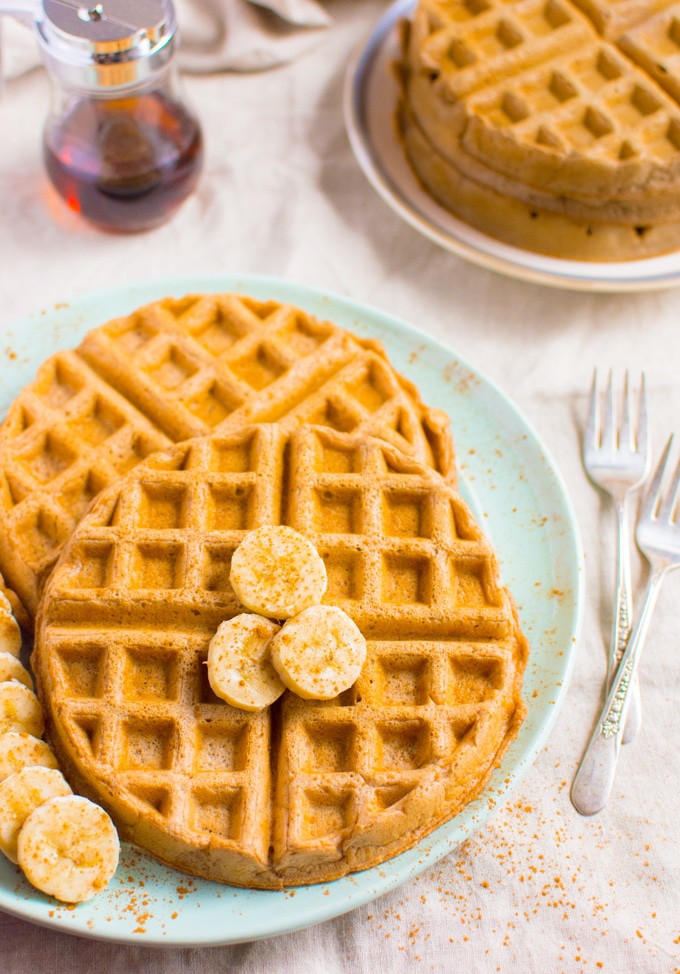 Cinnamon Vegan Waffles topped with banana slices.