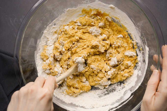 Pumpkin dinner rolls dough being mixed.