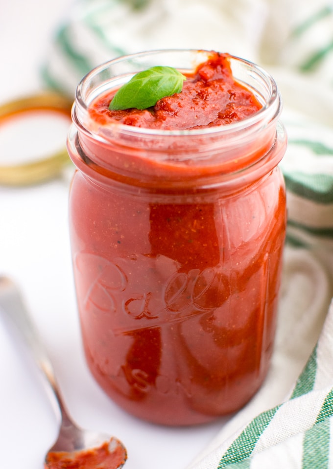 Homemade marinara sauce in a glass jar.