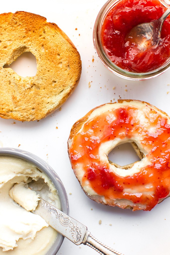 A toasted bagel spread with cashew cream cheese