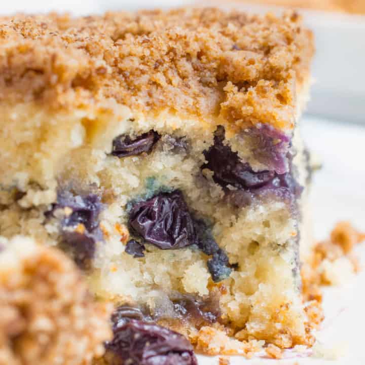 Vegan blueberry breakfast cake with bite missing.