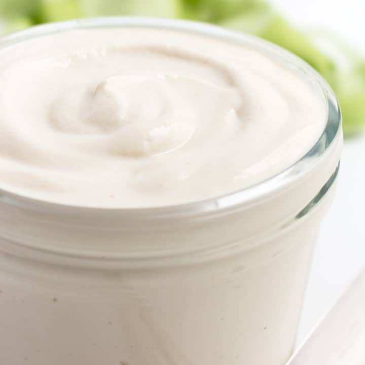 Vegan cashew mayo in a glass jar.