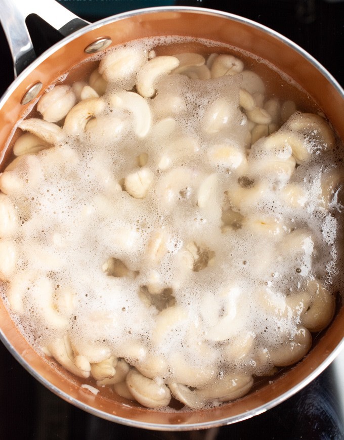 Raw cashews boiling to soften. 