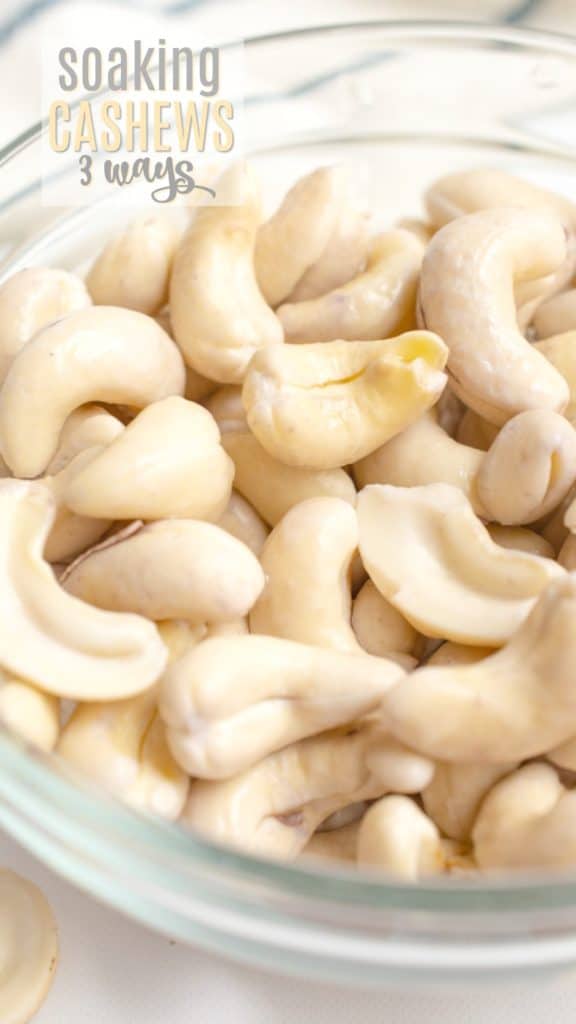 Softened cashews in a glass bowl after soaking.