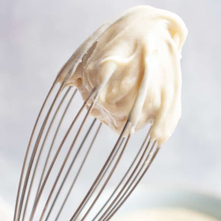 cashew frosting whipped on a whisk.