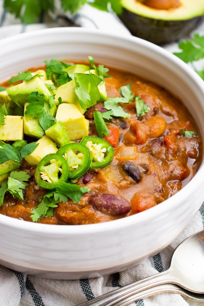 The best vegan chili topped with avocado, cilantro and jalapeño. 