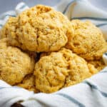 A closeup of sweet potato biscuits with a blue stripe towel.