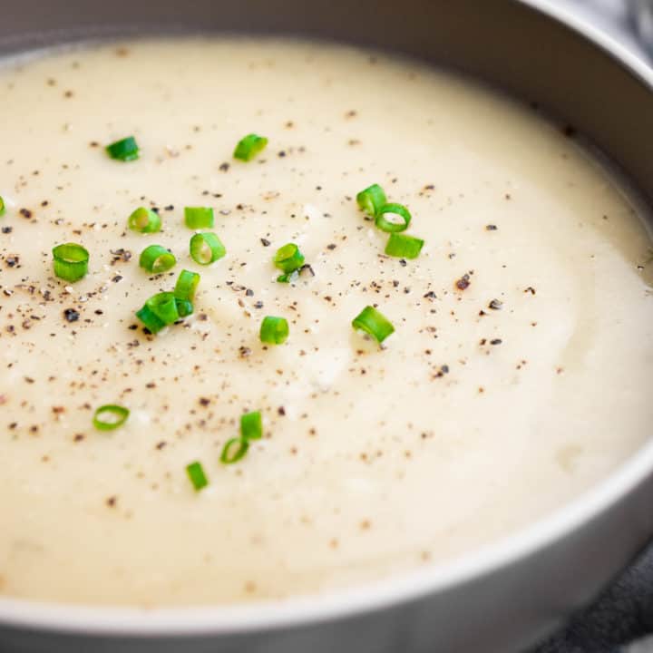 A bowl of vegan potato soup with cauliflower.