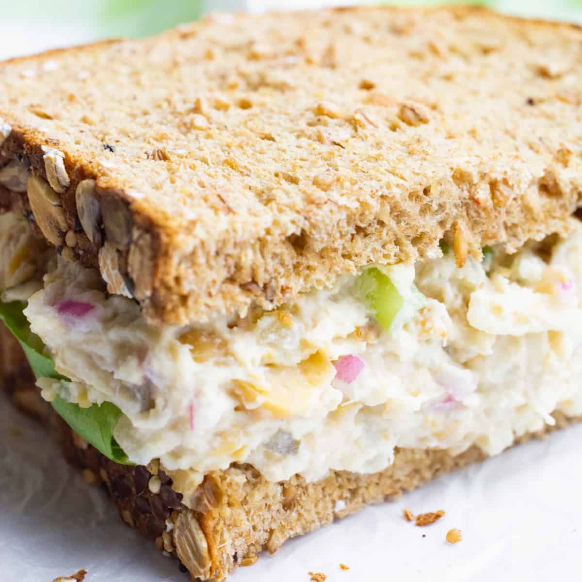 Vegan tuna salad sandwich on wheat bread.