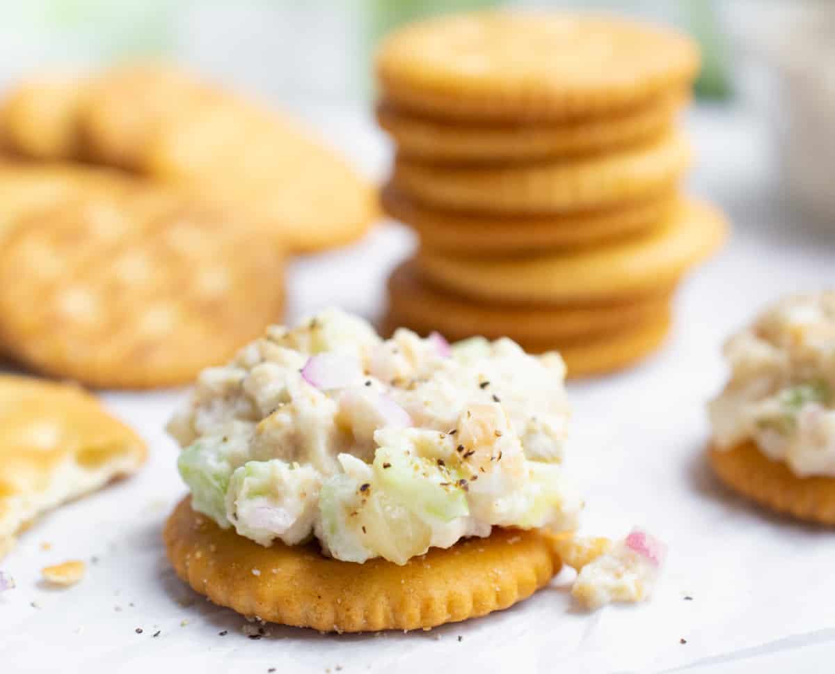 Cracker topped with vegan tuna salad.
