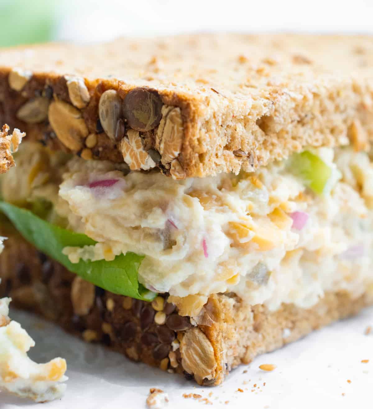 Half of a hearts of palm and chickpea sandwich.