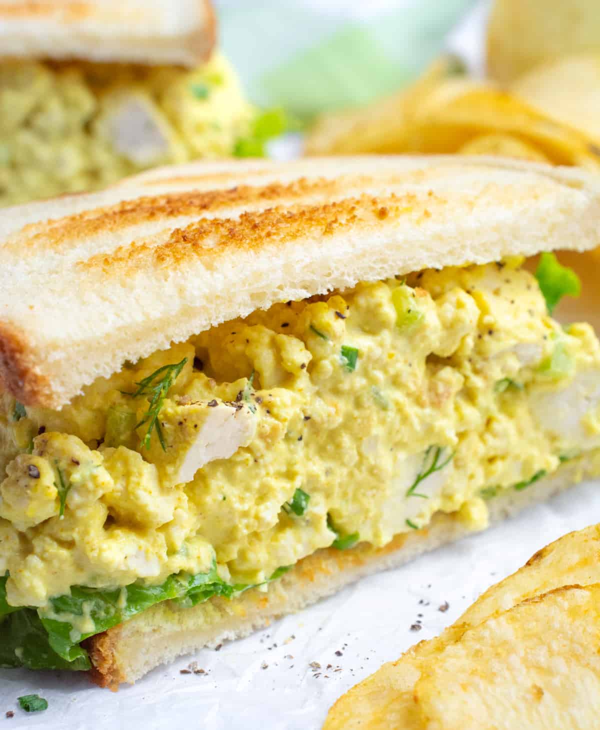 Half of a vegan egg salad sandwich.