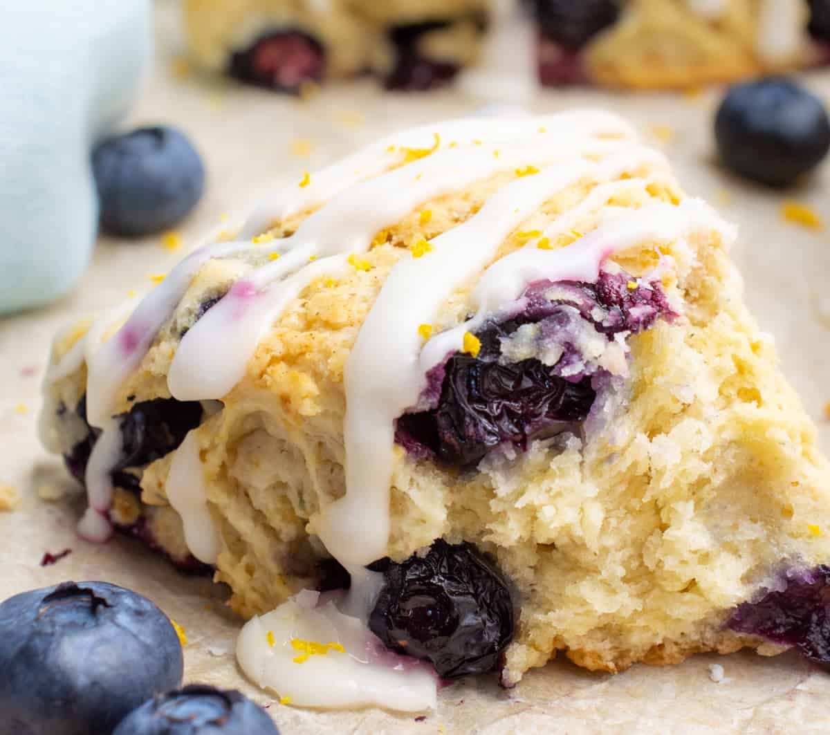 A blueberry scone broken into to show the inside.