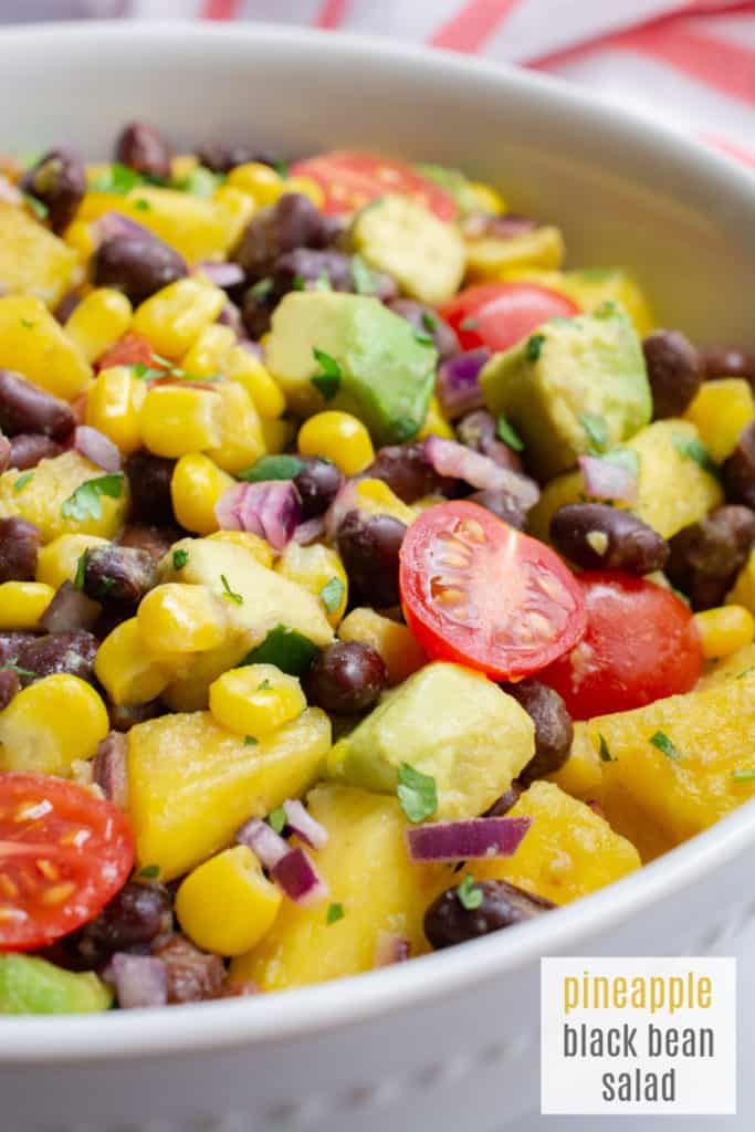 pineapple black bean salad in a white bowl.
