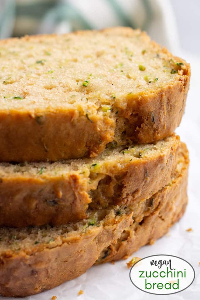 3 stacked slices of vegan zucchini bread.