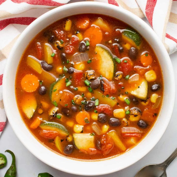 A top image of a bowl of southwest vegetable soup.