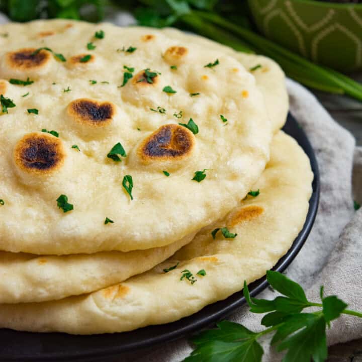 A stack of 3 fluffy vegan naan.