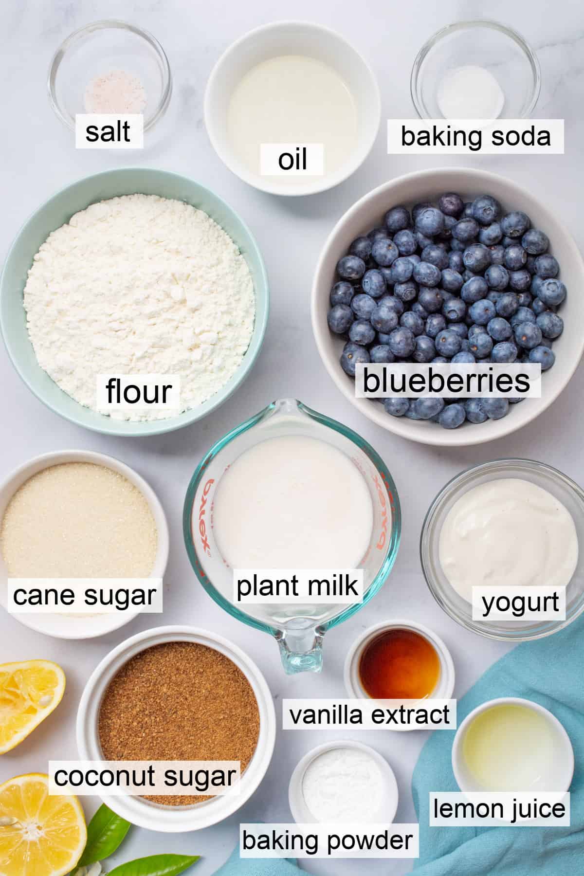 Separate bowls of ingredients for vegan blueberry breakfast cake.