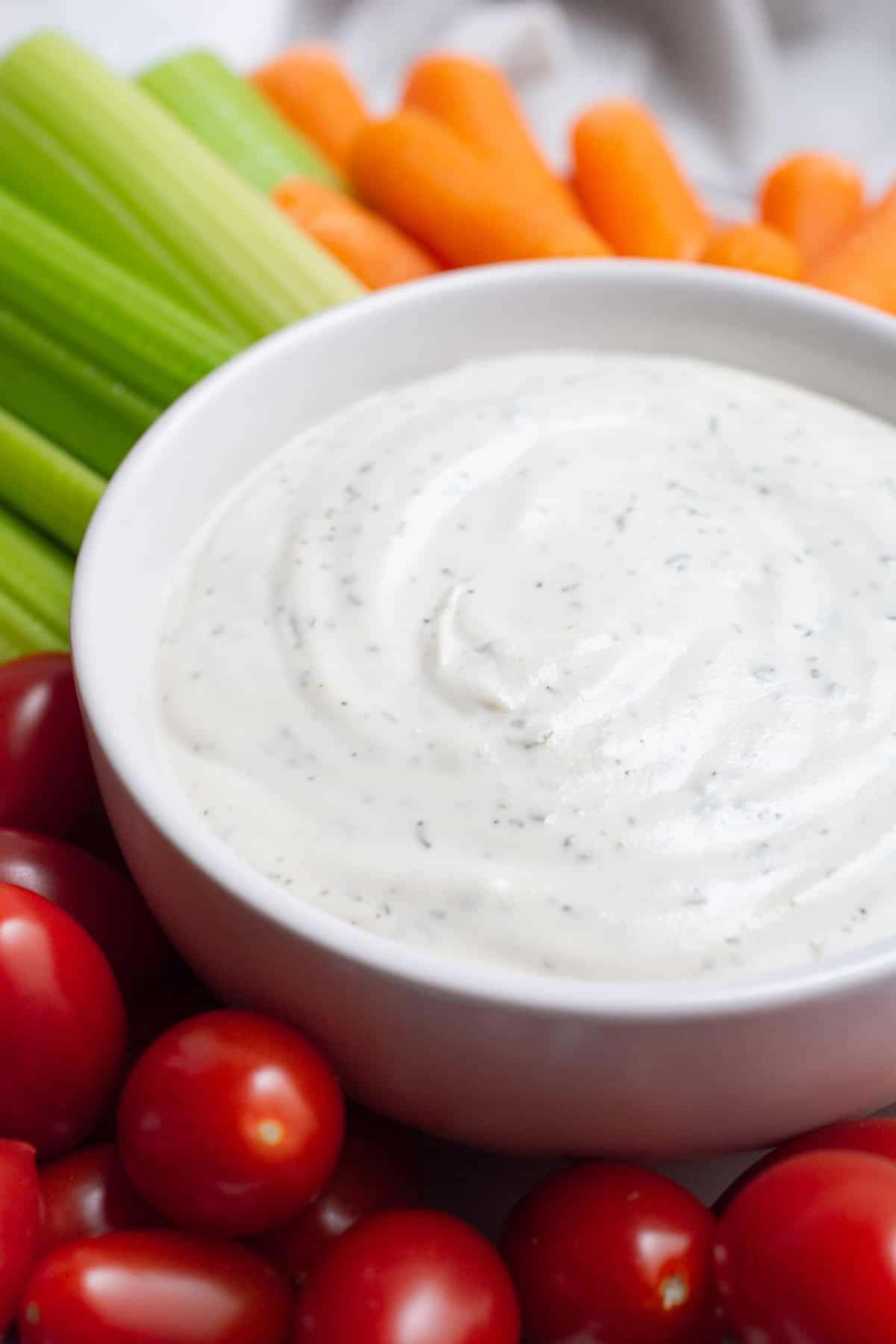 Vegan ranch dip in a white bowl.