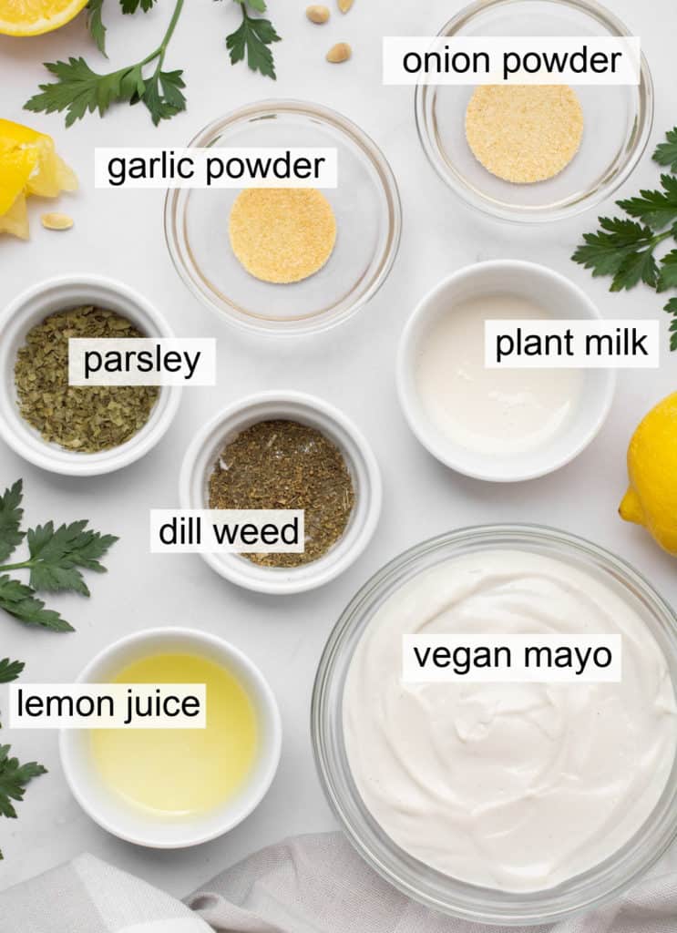 Small bowls of ingredients for vegan ranch dip.